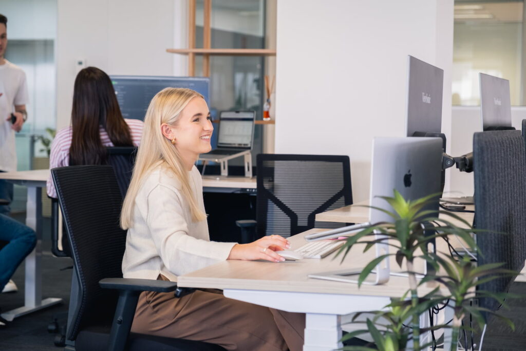 SEO Account Manager - Nicola Working In Office